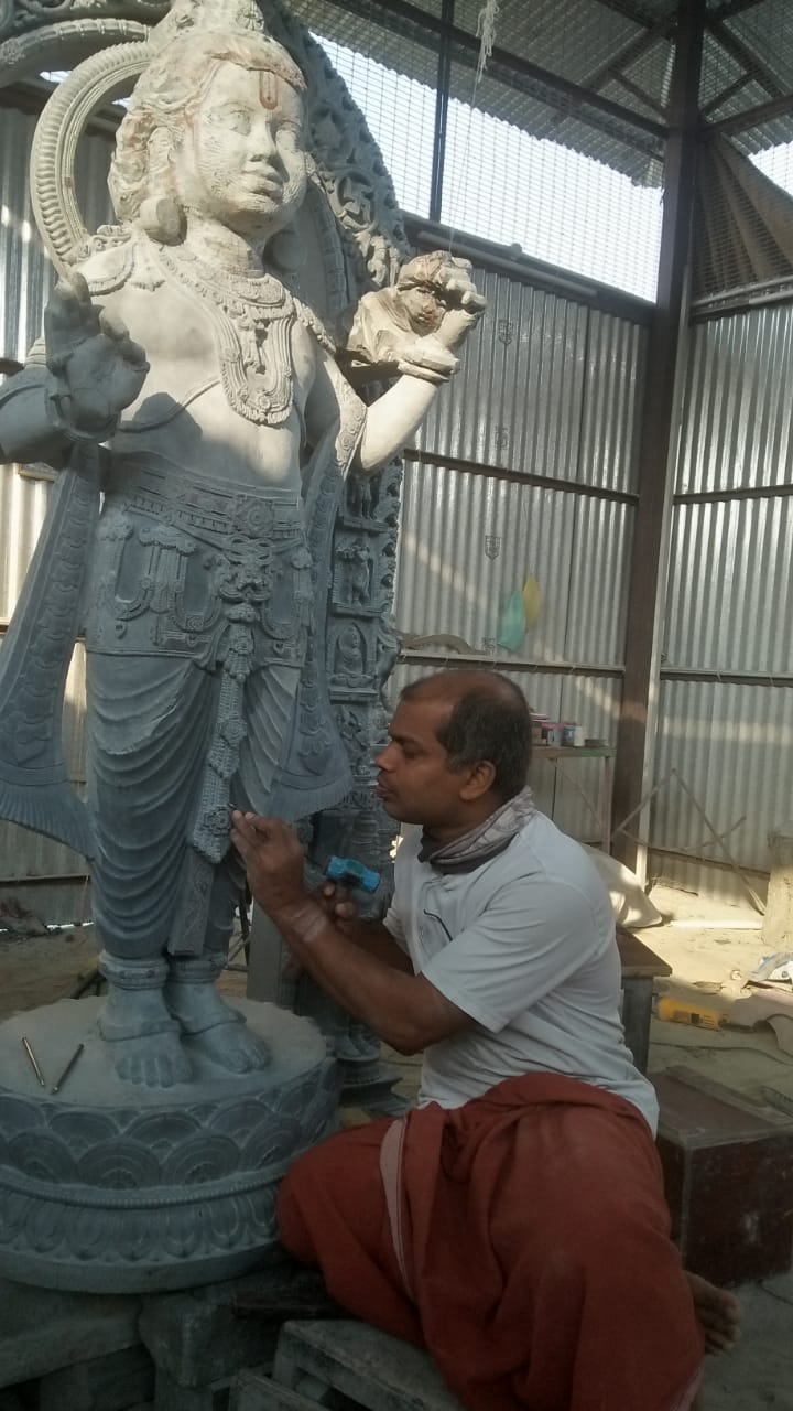 Sri Chidananda Acharya at work on a large temple deity sculpture