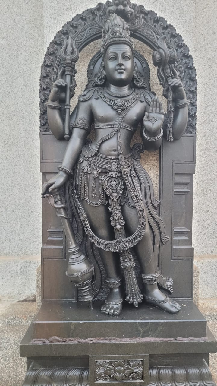 Large standing Vishnu deity in polished black granite — temple installation piece